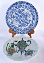 A LARGE 19TH CENTURY CHINESE FAMILLE VERTE CHARGER together with another. Largest 36.5 cm