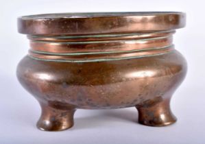 AN 18TH/19TH CENTURY CHINESE BRONZE CENSER bearing Xuande marks to base, of plain form, supported on