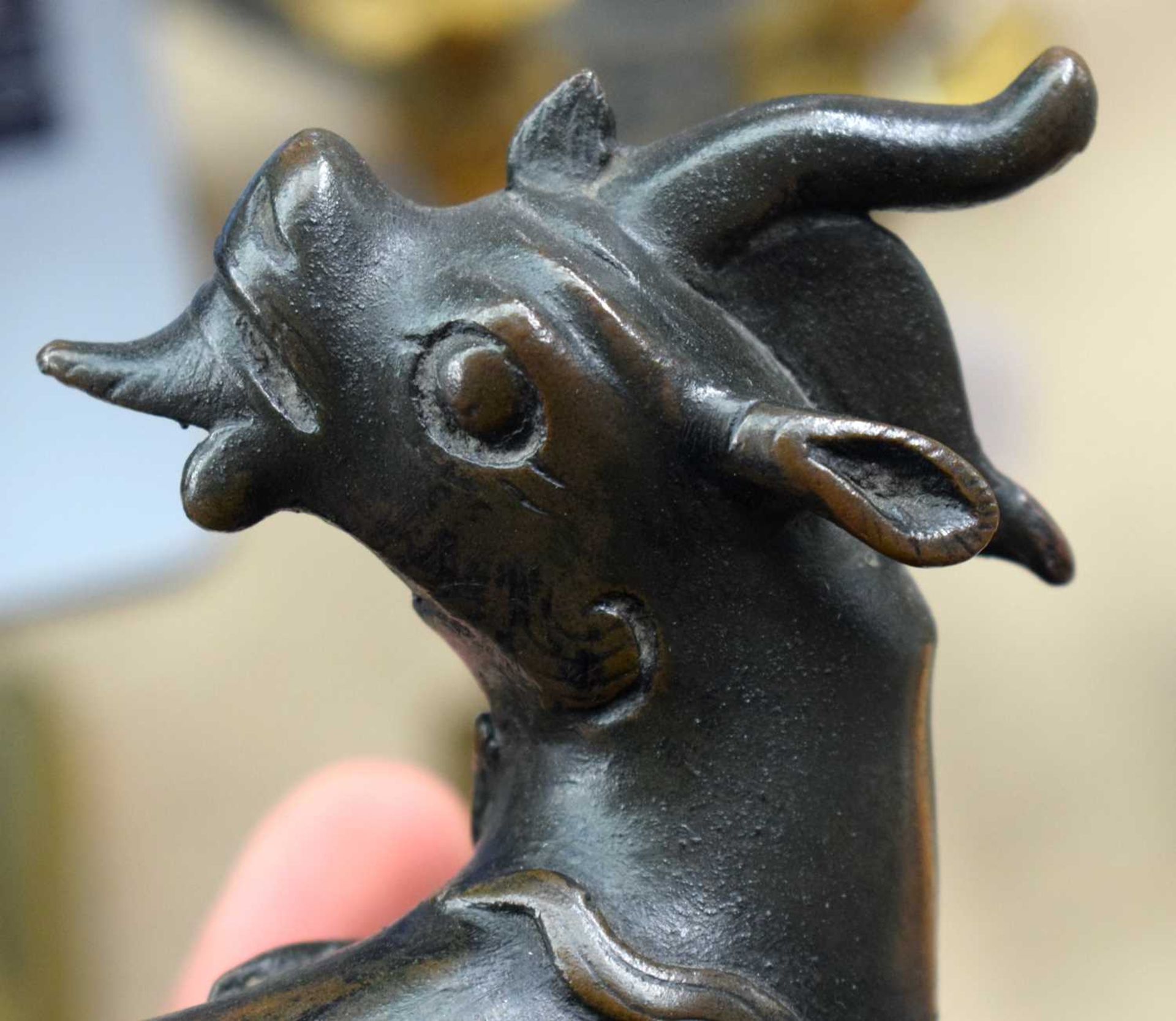 A 16TH/17TH CENTURY CHINESE BRONZE FIGURE OF A STYLISED BEAST Ming/Qing, modelled as a stylised - Image 9 of 14