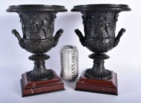 A LARGE PAIR OF 19TH CENTURY TWIN HANDLED GRAND TOUR COUNTRY HOUSE MEDICI URNS decorated in relief