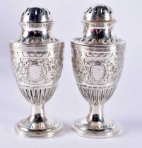 A Pair of Victorian Silver Condiments. Hallmarked London 1886. 9.5cm x 4cm, total weight 105.2g (2)