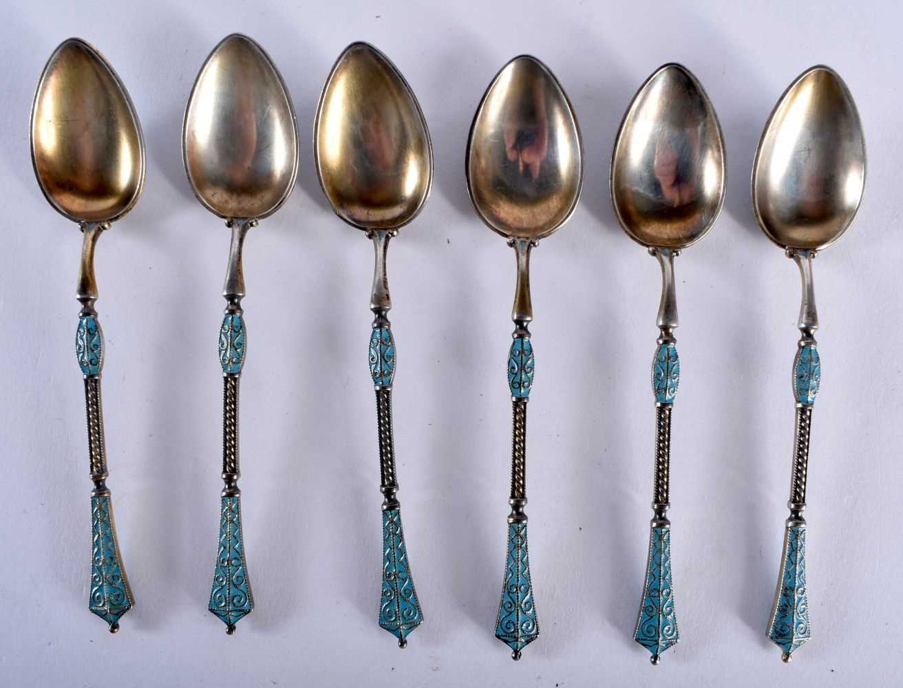 A SET OF SIX CONTINENTAL SILVER AND ENAMEL SPOONS. 52 grams. 9.5 cm long. (6)