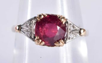 A 14CT GOLD RUBY AND DIAMOND RING the ruby approx 7 mm x 7 cmm and 1.65 cts. N. 2.2 grams.