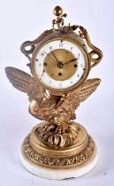 A 19TH CENTURY FRENCH EMPIRE STYLE BRONZE FIGURE OF AN EAGLE CLOCK modelled holding aloft an