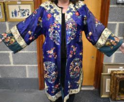 A FINE 19TH CENTURY CHINESE SILK EMBROIDERED ROBE Qing, decorated all over with flowers and assorted