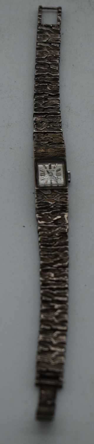 A SILVER ACCURIST WRISTWATCH. 34 grams. 1.25cm inc crown, strap 15.5 cm.