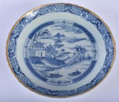 AN 18TH CENTURY CHINESE BLUE AND WHITE PORCELAIN SCALLOPED DISH Yongzheng/Qianlong. 22 cm wide.