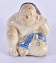 A 17TH/18TH CENTURY JAPANESE KOREAN BLUE AND WHITE POTTERY BRUSH WASHER formed as a seated male
