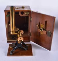 A Vintage Brass Microscope in a Fitted Wooden Box with key. Box 26.5cm x 19cm x 14.5cm