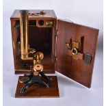 A Vintage Brass Microscope in a Fitted Wooden Box with key. Box 26.5cm x 19cm x 14.5cm