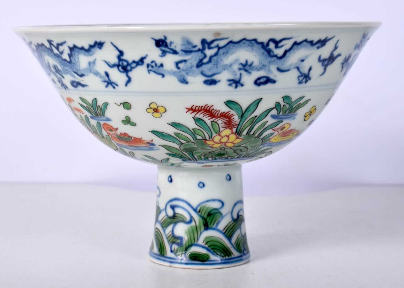 A Chinese porcelain Stem cup with symbols to the interior and Dragons 11 x 17 cm. - Image 3 of 8