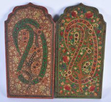 A PAIR OF 19TH CENTURY PERSIAN ISLAMIC PAINTED AND LACQUERED COUNTRY HOUSE WOOD PLAQUES. 30cm x 15