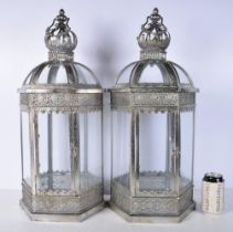 A pair of glass and metal lanterns with crown tops 64 cm (2)