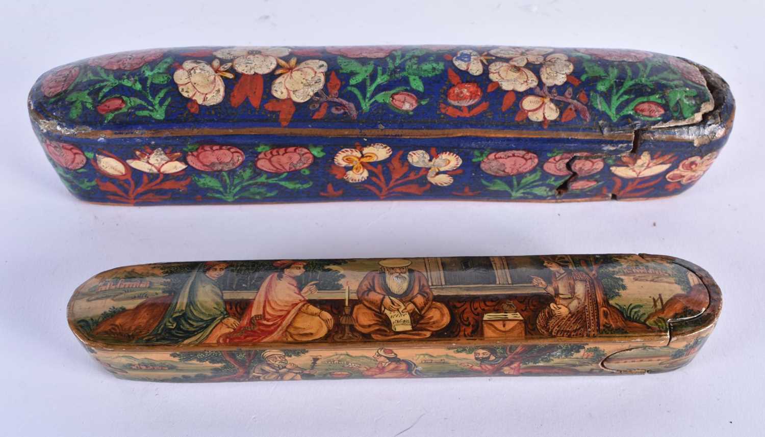 TWO 19TH CENTURY PERSIAN LACQUERED PEN BOXES Qualamdan, one painted with figures within an interior,