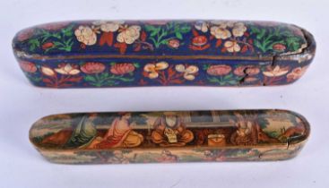 TWO 19TH CENTURY PERSIAN LACQUERED PEN BOXES Qualamdan, one painted with figures within an interior,