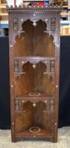 A large carved wood Moorish corner display cabinet inlaid with mother of pearl 185 x 71 x 47 cm.