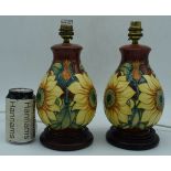 A pair of Moorcroft Inca pattern Sunflower lamp bases 27 cm (2).