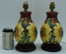 A pair of Moorcroft Inca pattern Sunflower lamp bases 27 cm (2).