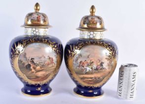 A LARGE PAIR OF 19TH CENTURY GERMAN DRESDEN PORCELAIN VASES AND COVERS painted with fighting