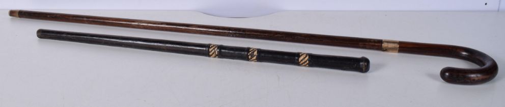 A wooden walking cane with a 9 Ct gold collar stamed 1928 together with another leather encased