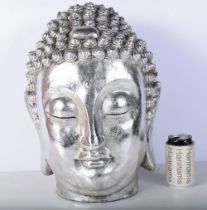 A large Buddhas head 43 cm.