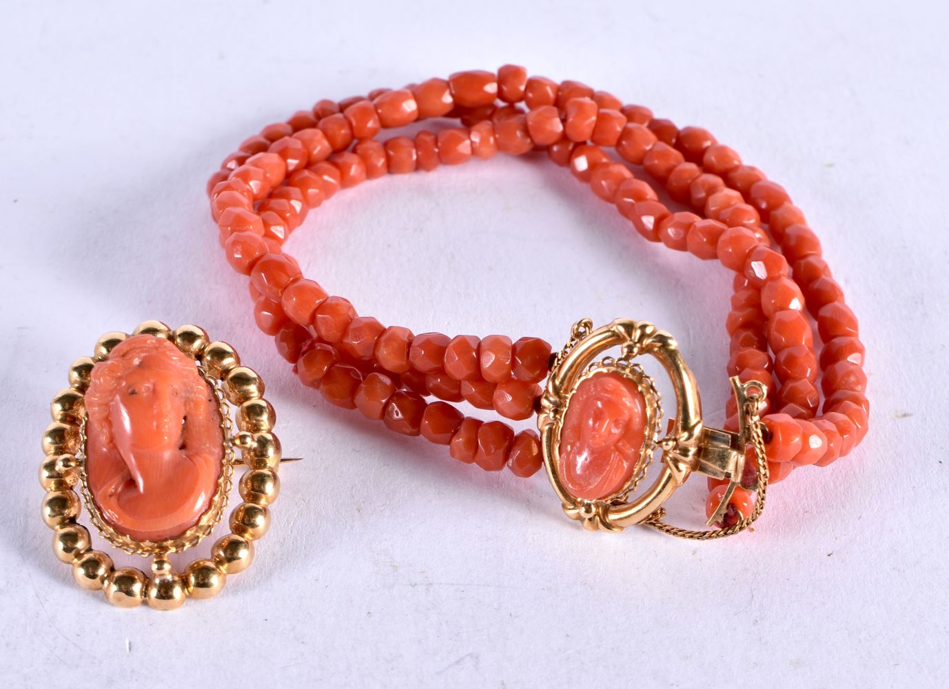 A High Carat Gold Mounted Coral Bracelet and Brooch. Chinese Marks, Bracelet 18cm long, Brooch 3