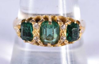 A VICTORIAN 18CT GOLD EMERALD AND DIAMOND RING. R. 4.3 grams.