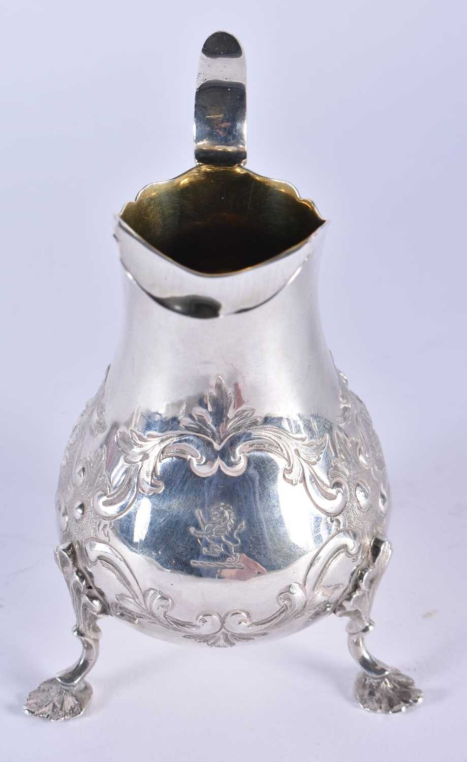 A VICTORIAN SILVER REPOUSSE CREAM JUG. London 1869. 163 grams. 14 cm x 10 cm. - Image 2 of 4