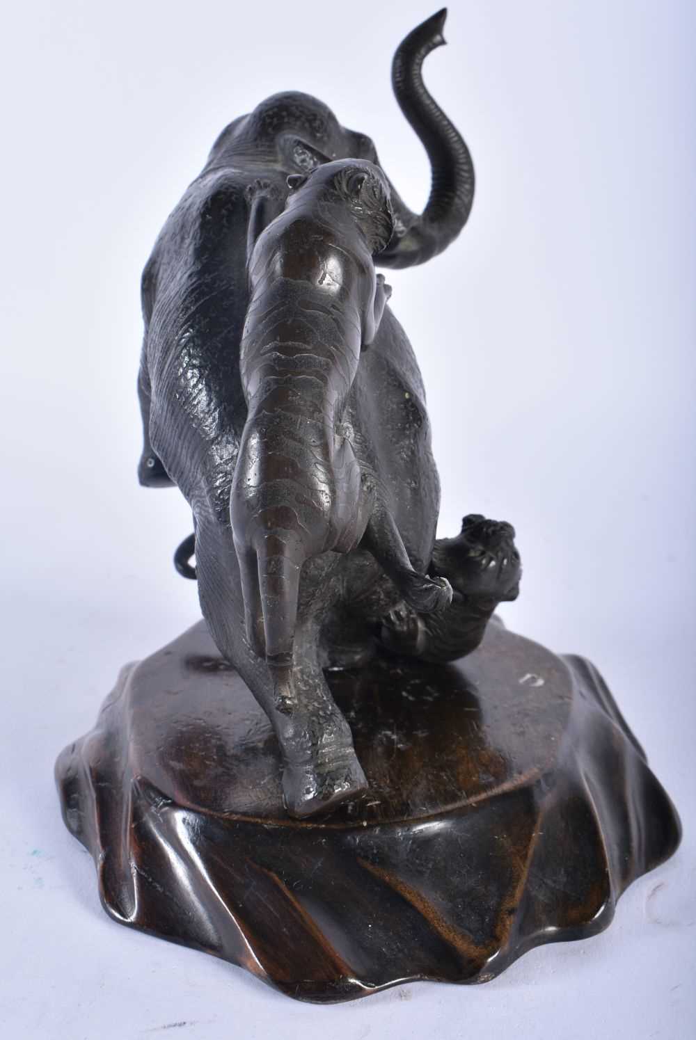 A 19TH CENTURY JAPANESE MEIJI PERIOD BRONZE OKIMONO modelled as an elephant being attacked by - Image 6 of 8