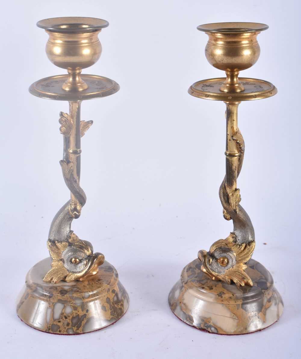 A PAIR OF REGENCY COUNTRY HOUSE SILVERED BRONZE CANDLESTICKS formed as fish. 18cm high.