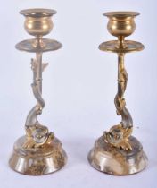 A PAIR OF REGENCY COUNTRY HOUSE SILVERED BRONZE CANDLESTICKS formed as fish. 18cm high.