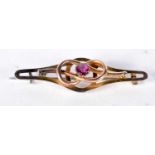 A 9 Carat Gold Bar Brooch set with an Amethyst. Stamped 9CT. 4.4cm x 1.2 cm, weight 2.3g