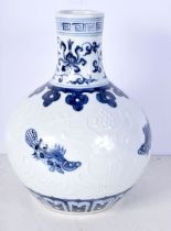 A Chinese porcelain blue and white vase decorated in relief with fish and Algae in relief 27 cm.