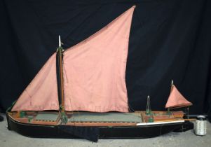 A large wooden model of a Thames sailing barge 130 x 29 cm.