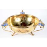 A CONTINENTAL SILVER GILT AND ENAMEL TRI LEGGED DISH. 326 grams. 17 cm x 8.5 cm.