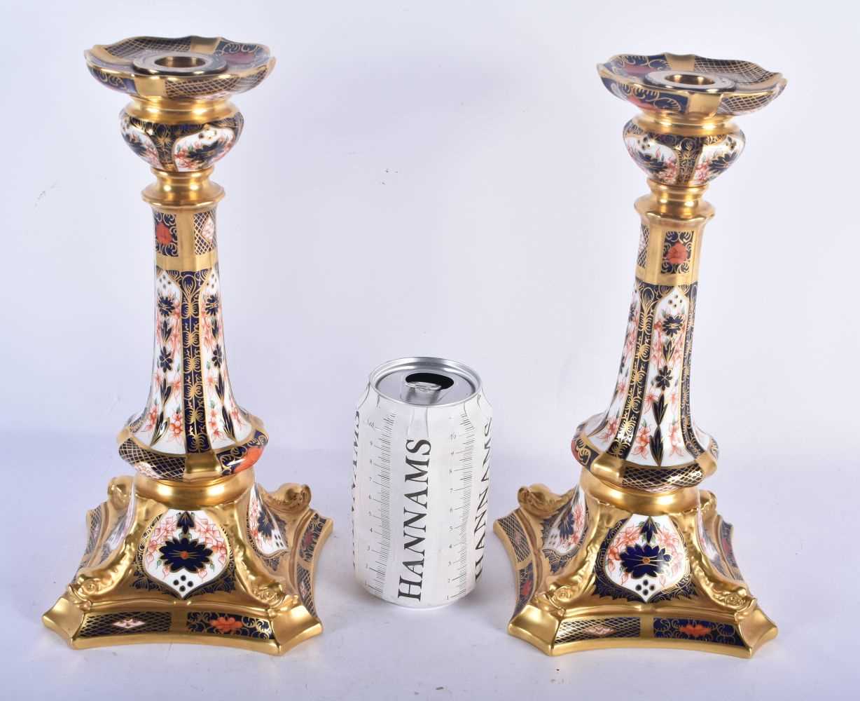 A LARGE PAIR OF ROYAL CROWN DERBY IMARI CANDLESTICKS. 27 cm high.