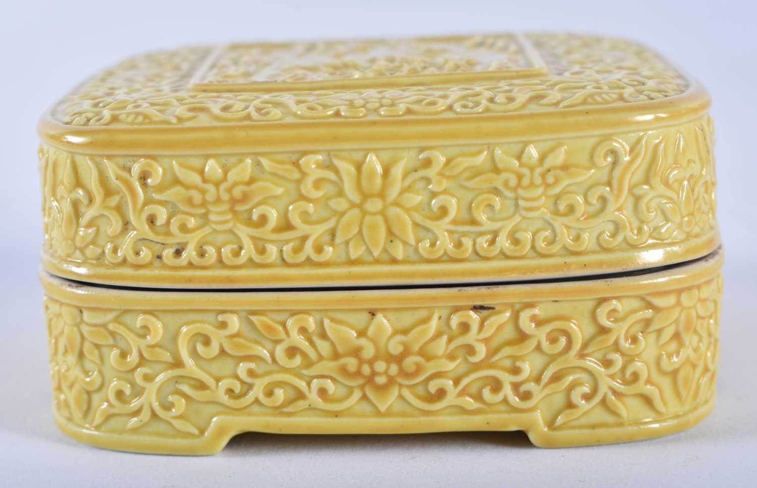 A 19TH CENTURY CHINESE IMPERIAL YELLOW GLAZED BOX AND COVER bearing Qianlong marks to base. 7 cm