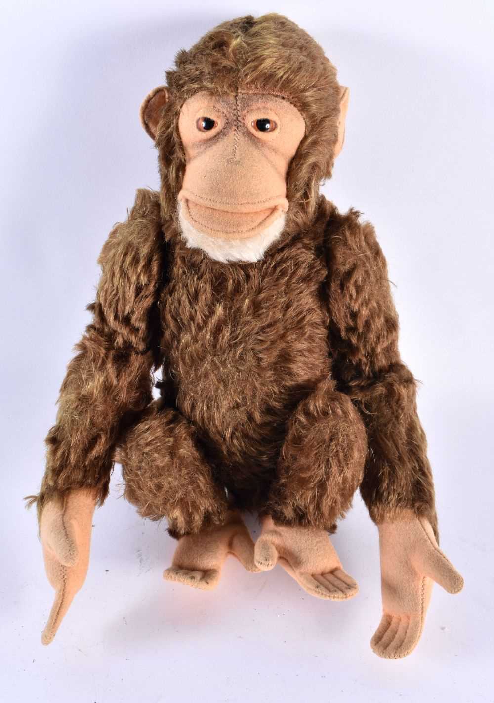 A MID CENTURY POSSIBLE STEIFF MONKEY WITH SQUEAKER. 25cm high.