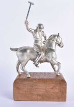 AN ANTIQUE SILVER PLATED AND PINE POLO PLAYER FIGURE. 794 grams. 19 cm x 10 cm.