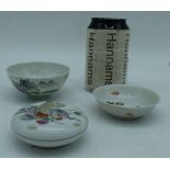 A small Chinese porcelain Famille rose cosmetic pot together with two small bowls 4 x 9 cm. (3)