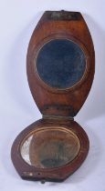 AN ANTIQUE MILITARY CARVED WOOD FOLDING CAMPAIGN SHAVING MIRROR. 30cm x 9.5 cm extended.