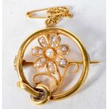 A 15 Carat Gold Flower Brooch set with Pearls with Safety Chain. Stamped 15 CT. 2.1cm diameter,