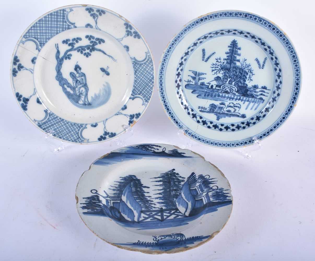 THREE 18TH CENTURY DELFT TIN GLAZED POTTERY PLATES one painted with a single figure, two painted