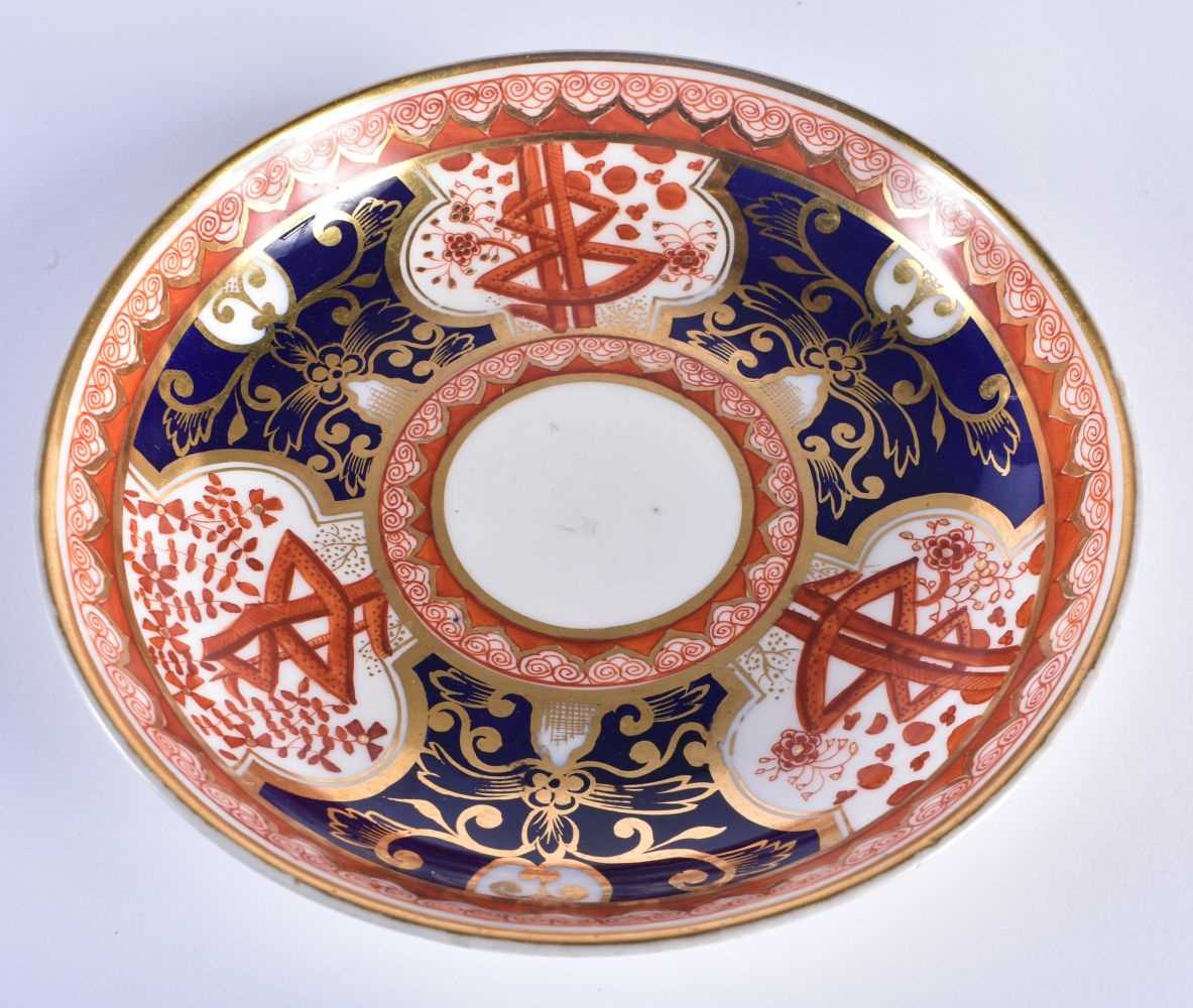 Spode teacup and saucer painted with the “Dollar” pattern and a saucer dish in the same pattern - Image 5 of 9