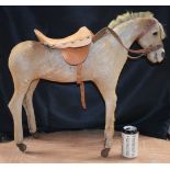 A Victorian hide covered pull along child's horse 55 x 62 cm.