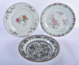 THREE 18TH CENTURY CHINESE FAMILLE ROSE PLATES Qianlong, painted with flowers. 23.5 cm diameter. (