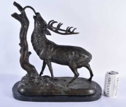 A LARGE BRONZE AND MARBLE FIGURE OF A STAG modelled beside a tree stump. 44 cm x 36 cm.