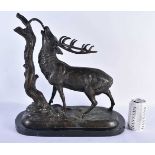 A LARGE BRONZE AND MARBLE FIGURE OF A STAG modelled beside a tree stump. 44 cm x 36 cm.