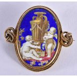 An Early 19th Century High Carat Gold and Enamel Brooch decorated with Cherubs. 4.4cm x 4.5 cm,