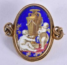 An Early 19th Century High Carat Gold and Enamel Brooch decorated with Cherubs. 4.4cm x 4.5 cm,